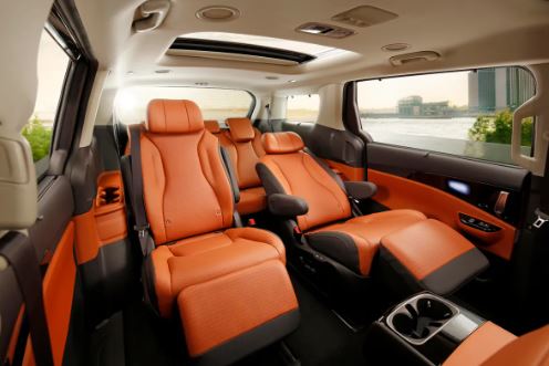 Rent KIA Sedona Van with Driver in Dubai Abu Dhabi Sharjah UAE Best Cheap Rate Price Charges Book Hourly Daily Weekly